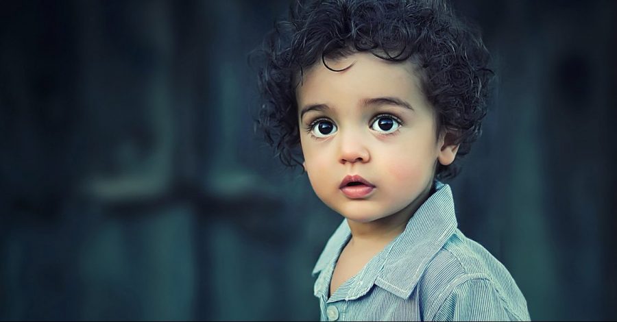 Photo of a child with brown googly eyes
