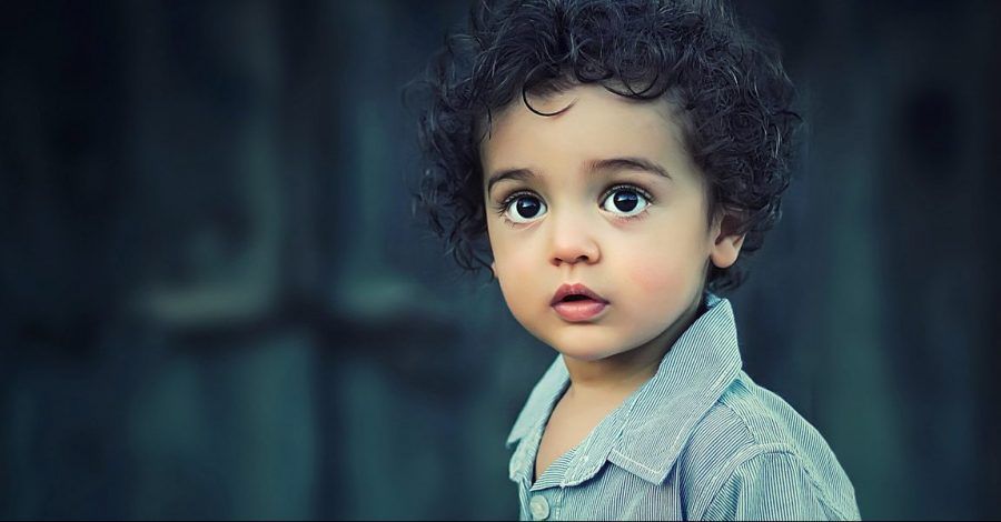Photo of a child with brown googly eyes