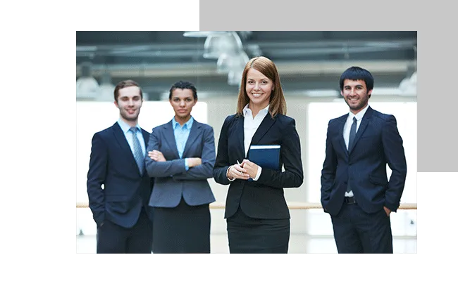 Employees smiling at the camera.