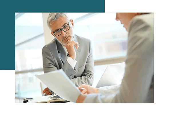 A supervisor conducts an employee feedback session with his employee.