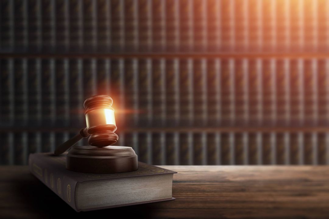 Judge's gavel and a book on a wooden table. Concept of law, justice, punishment, judge, corrupt court. copy space