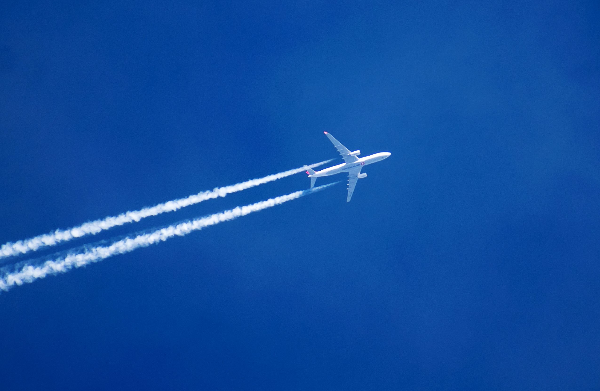 blue sky, airplane shot from far away