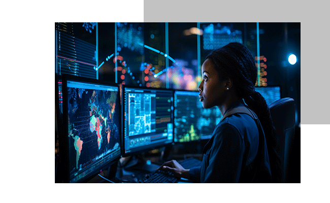 Eine Frau sitz vor Bildschirmen und sieht die Ergebnisse der Feedbackautomatisierung Ihrer Kundenbefragungen an.