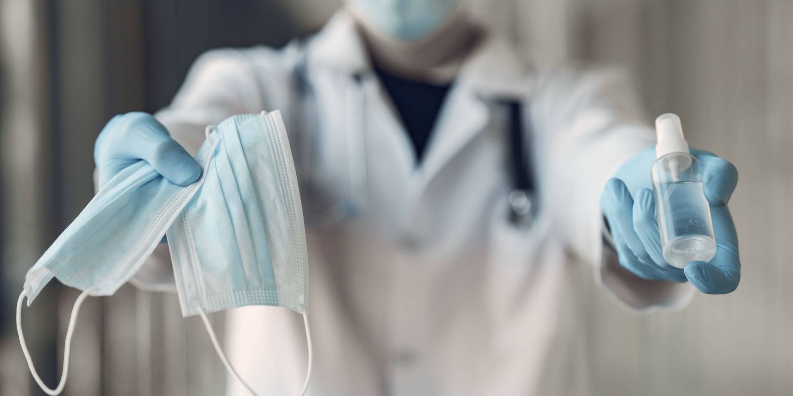 Doctor with antiseptic. Coronavirus theme.