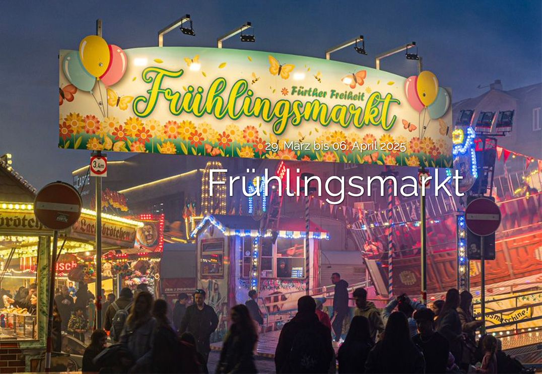 Fürther Frühlingsmarkt: Bunte Marktstände, fröhliche Besucher und Karussells vor historischer Kulisse der Fürther Freiheit
