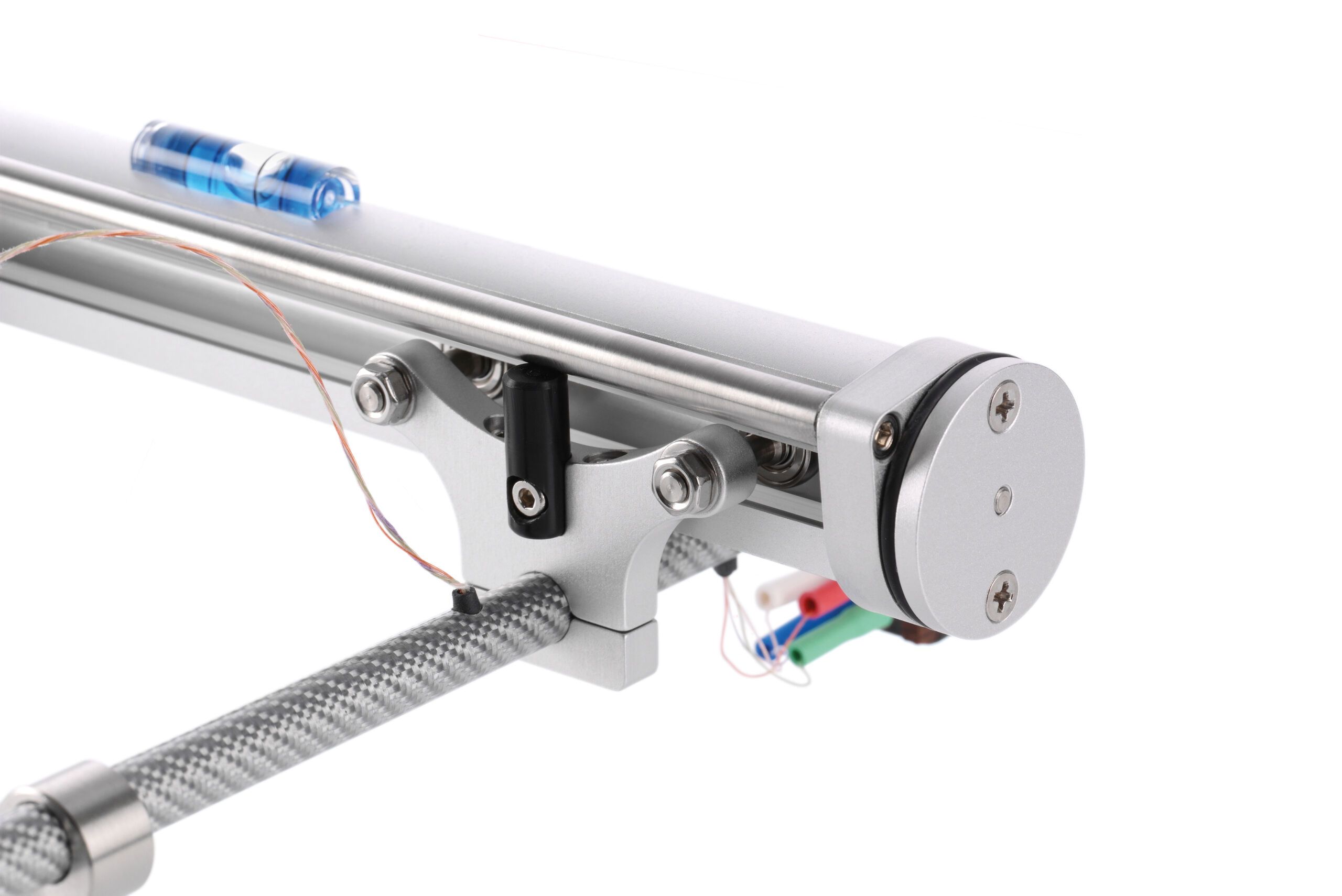 Close-up of the silver Clearaudio TT5 tangential tonearm, focusing on the polished glass tube, the mechanical guide and a blue mini spirit level attached to it.