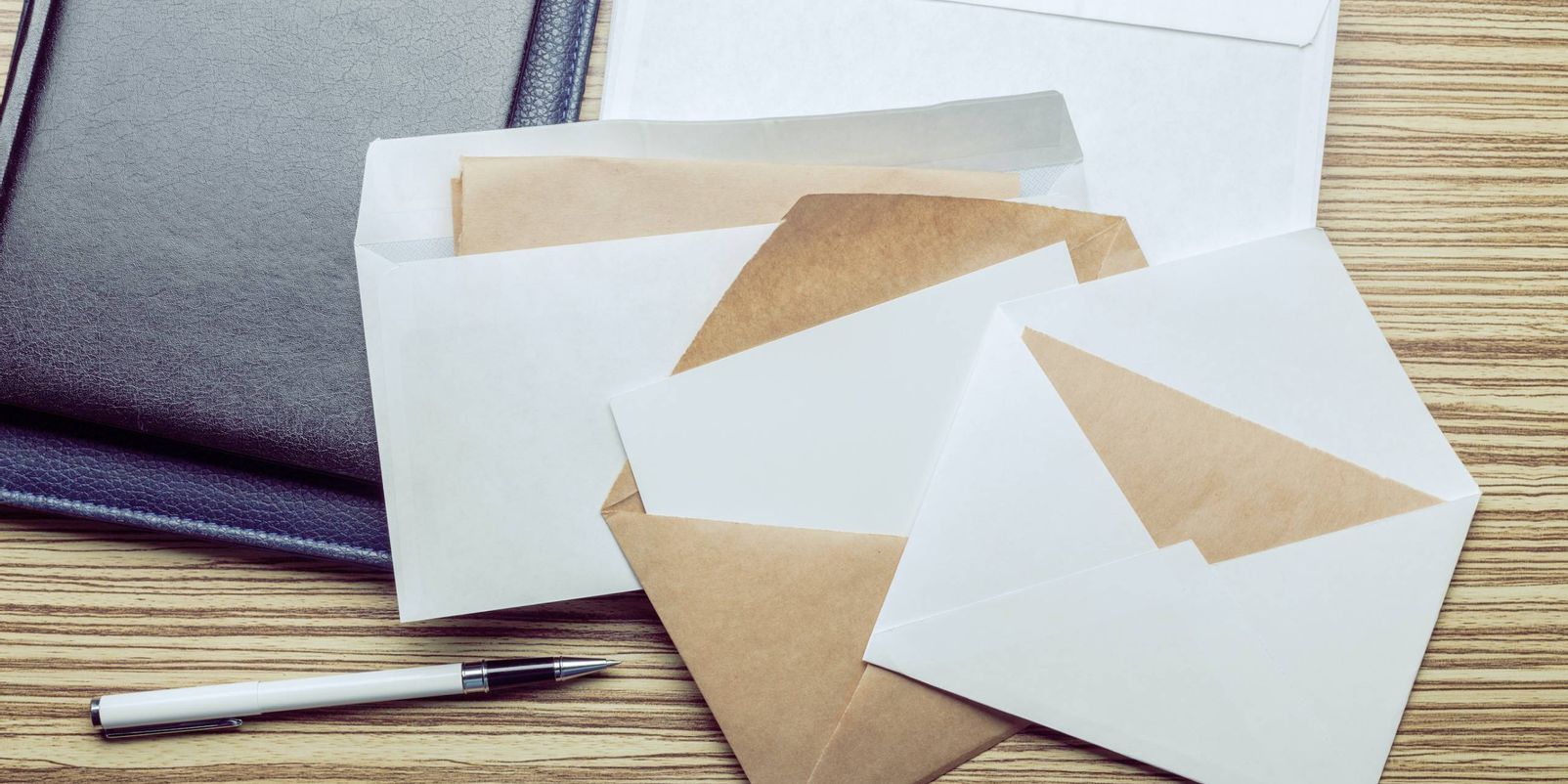 Photo of blank envelope on a  wooden background